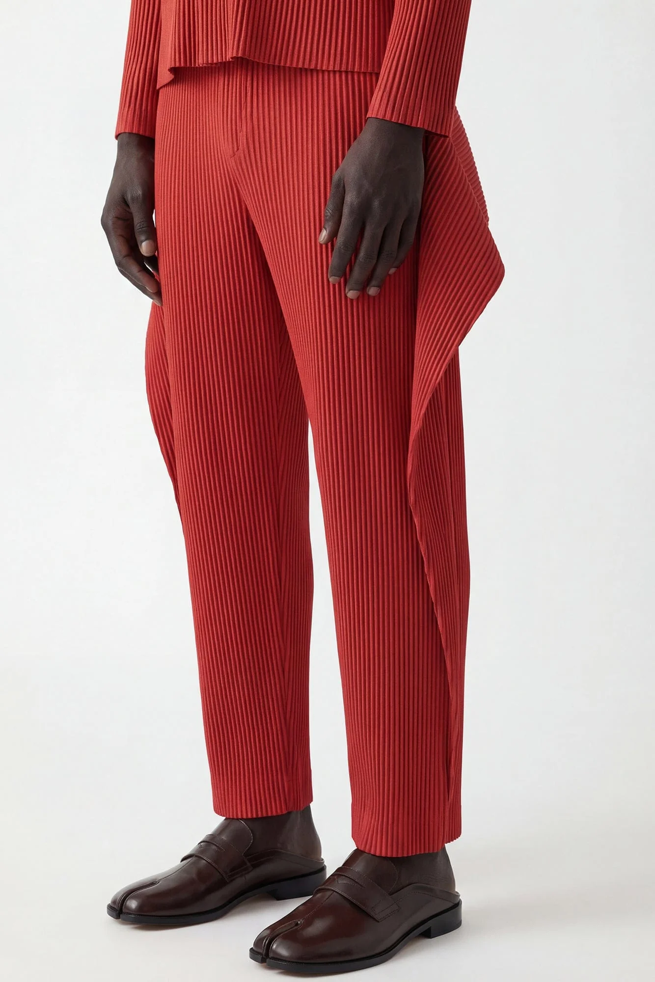 Homme Plissé Issey Miyake Cover and Fold Trousers in Tomato Red - Image 2